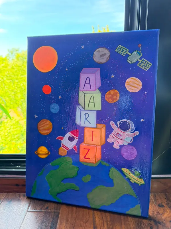 Space-themed name painting spelling Aariz in stacked blocks on a planet