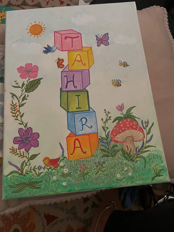 Floral name painting spelling Tahira in stacked blocks